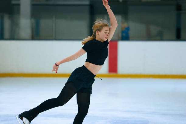 istock Figure skating girl training on ice arena. 2193091410