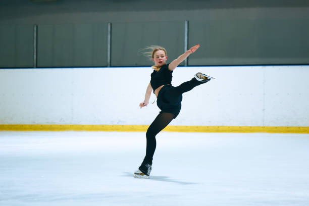 istock Figure skating girl training on ice arena. 2193091416