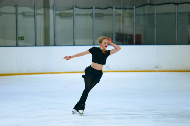 istock Figure skating girl training on ice arena. 2193091520