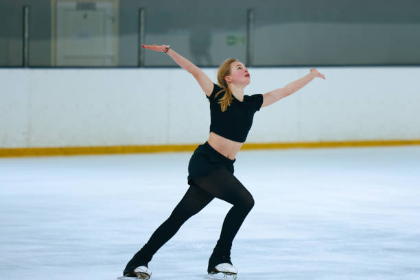 istock Figure skating girl training on ice arena. 2193091543