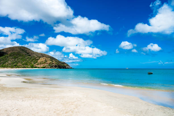 istock Lighthouse is on a hill overlooking the ocean 2193092386