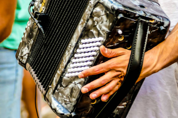 istock A man is holding a small accordion 2193094261