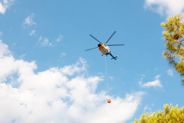 Helicopter flying over smoke clouds