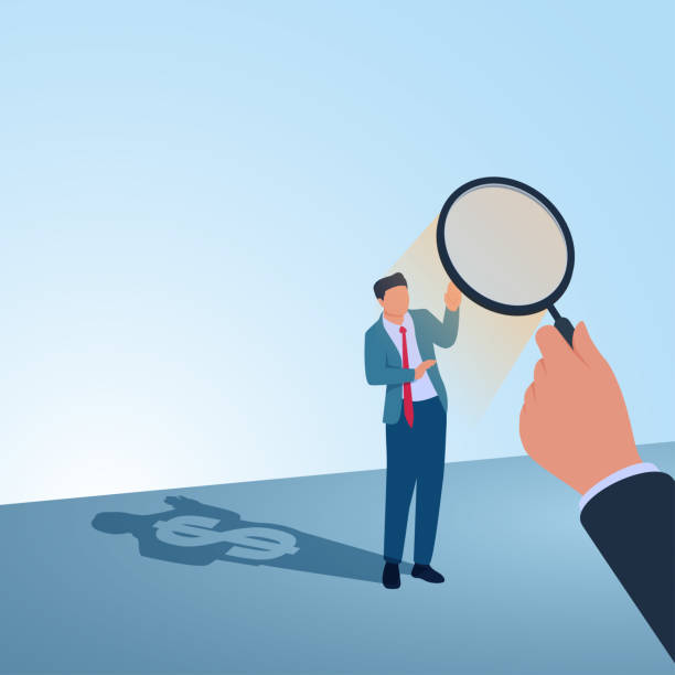 istock A man is shone through a magnifying glass and there is a shadow of money behind him. Illustration for corruption investigation, bribery investigation and looking for traces of misappropriation of funds. 2193094755