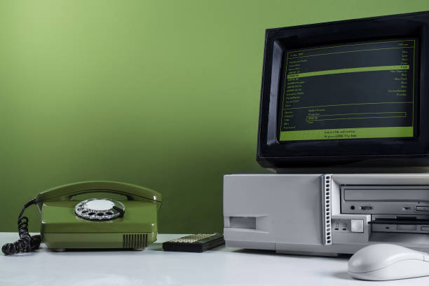 istock Vintage Office Technology: Retro Computer and Rotary Phone 2193095421