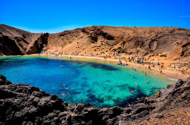 istock A beautiful blue lake with a rocky shoreline and a beach 2193096911