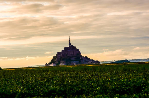 istock A castle is in the distance with a cloudy sky in the background 2193097013