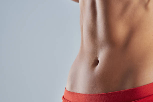 istock Young fit woman in red abdominal muscles 2193098927