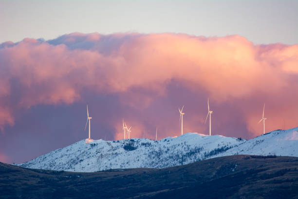 Windmills at twilight on a snow-covered mountain Kamensko near the city of Split in Croatia