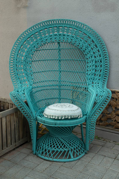 istock Blue curved wicker rattan chair with pillow closeup 2193099521