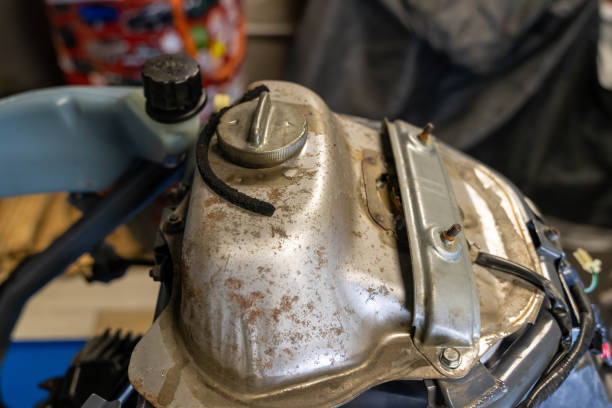 istock Rusty motorcycle gas tank awaiting repair in garage 2193100552