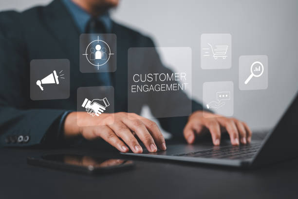 istock Customer engagement concept. Target customer, buyer persona and customer behavior. Businessman using laptop with customer engagement icon on virtual screen. 2193100559