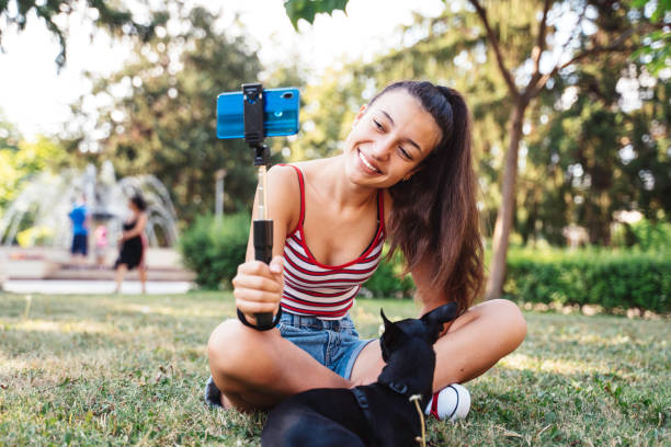 istock Capturing a delightful selfie with her pet dog. 2193103253