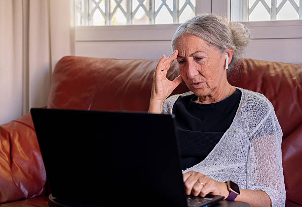 istock An older retired woman feeling anxious in front of her computer 2193103569