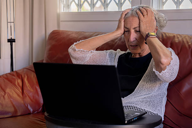 istock An older retired woman feeling anxious in front of her computer 2193103604