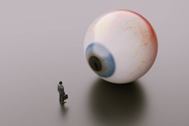 Giant eyes looking at business man