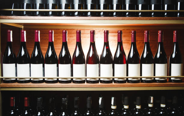 istock Elite Wine Bottles Lined Up in Wooden Cellar Rack, Showcasing Collection 2193109328