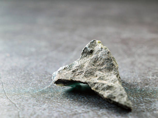 istock Close-up of basalt stone on gray background 2193112849