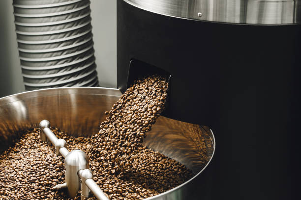 istock Freshly Roasted Coffee Beans Pouring Into Stainless Steel Cooling Bin 2193114609