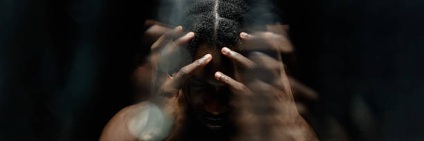 istock Header Image of Black Man Covering Face with Hands Suffering from Headache in Studio 2193114701