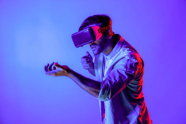 istock Side view of man wearing VR glass and moving gesture holding gun. Deviation. 2193114759