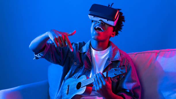 istock African singer using through VR enjoy singing with playing guitar. Contrivance. 2193115246