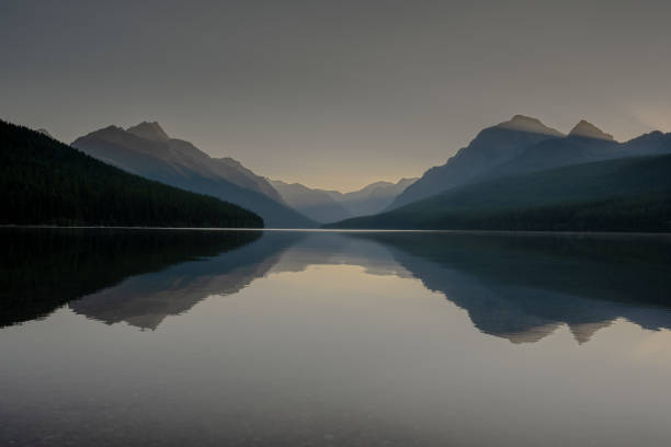 istock Reflections and Shafts Of Light Over Bowman Lake In Glacier 2193115381