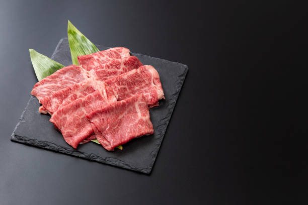 istock Beef shoulder loin for sukiyaki on a black background 2193115471