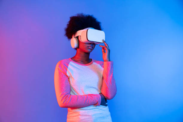 istock Profile thinking beautiful African wearing VR glasses metaverse. Contrivance. 2193115477