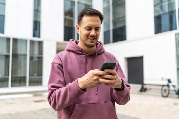 istock Handsome man checking fitness activity on phone after training 2193117731