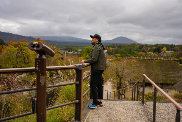 istock young man walking an explore  Fujikawaguchiko Town, Japan 2193118307