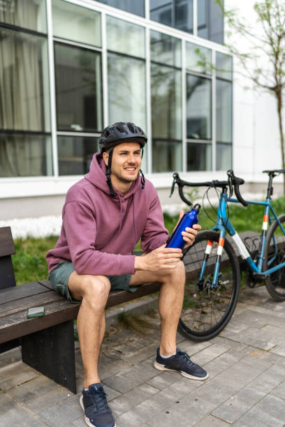 istock Cyclist drinking water after ride 2193118685