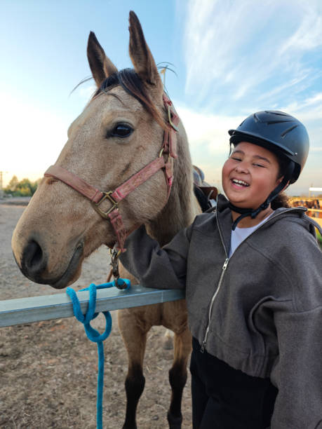 istock Joyful Moment with a Horse at the Stable. 2193118824
