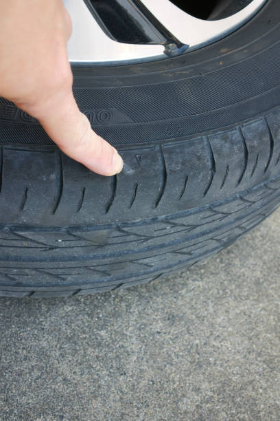 istock Check by pointing at the triangular mark on the tire slip sign 2193118913