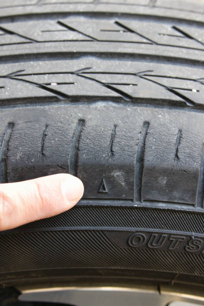 istock Check by pointing at the triangular mark on the tire slip sign 2193118937