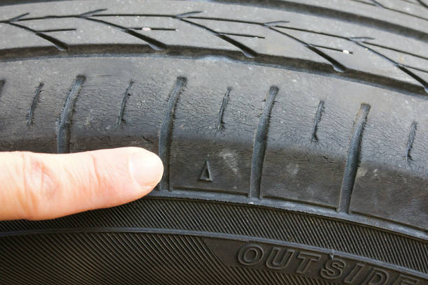 istock Check by pointing at the triangular mark on the tire slip sign 2193118950