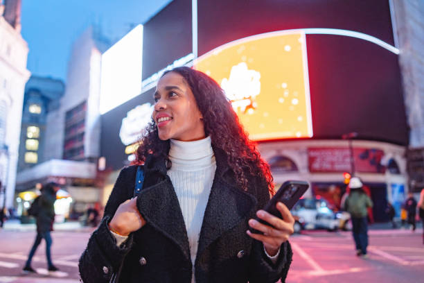 istock Hispanic Tourist Enjoying Piccadilly Circus at Night 2193119602