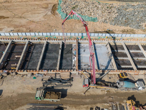 istock Construction site where machinery is being used to pour concrete 2193122034