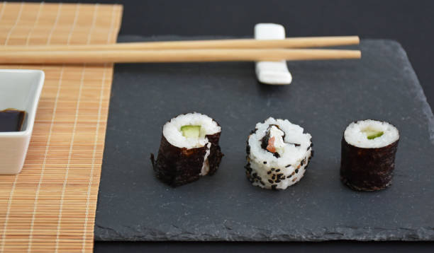 istock Japanese style table setting with three pieces of sushi and sundaries 2193122200