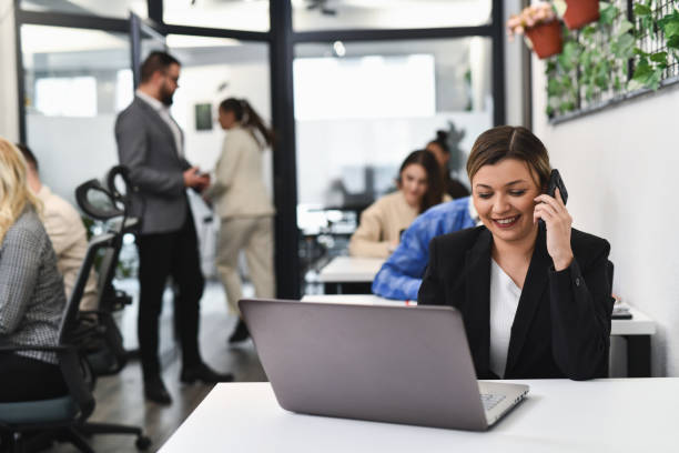 istock Smiling Secretary Having Work Call Talking With Client Scheduling Meeting With Her Boss 2193122275