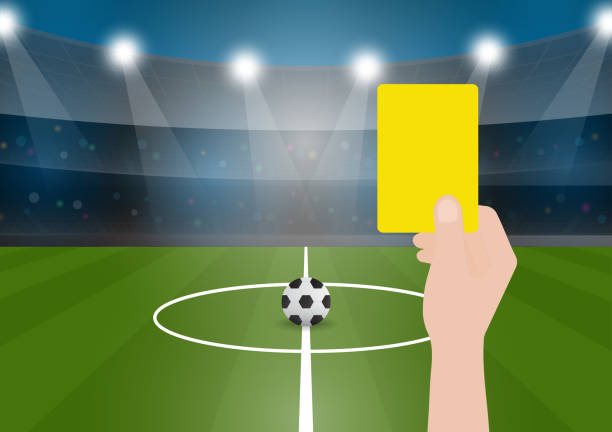 istock Hand Holding Yellow Card for Football Match. 2193123195