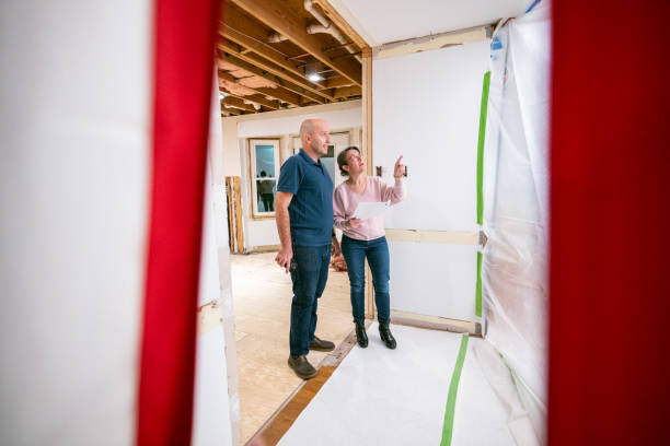 istock Couple supervising home renovation progress 2193124909