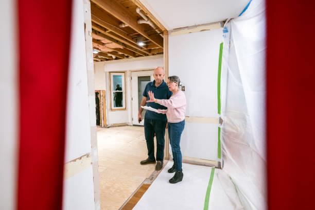istock Couple supervising home renovation progress 2193125082