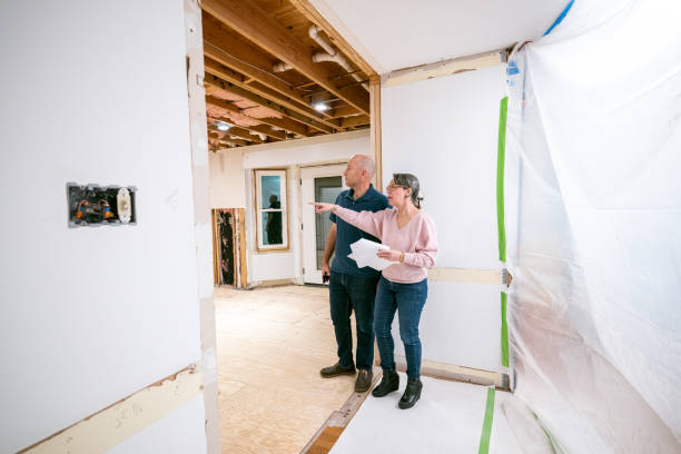 istock Couple supervising home renovation progress 2193125175