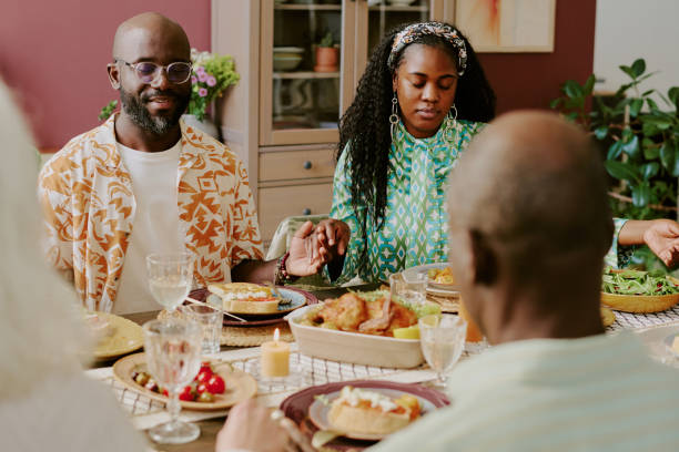 istock Wife and Husband Holding Hands while Praying 2193125994
