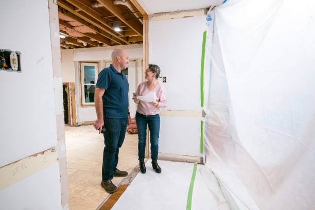 istock Couple supervising home renovation progress 2193126744