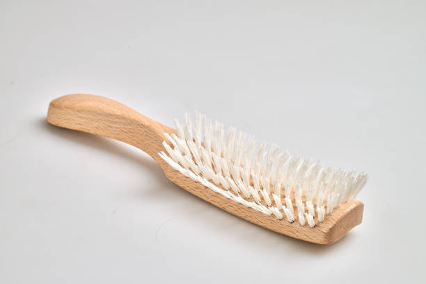 Wooden Hair brush with handle isolated on white bakground