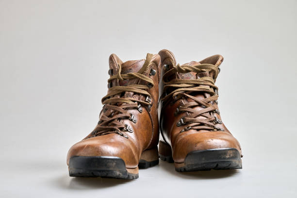 istock Vintage Brown  leather trekking shoes isolated on white 2193127418