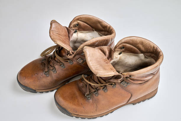 istock Vintage Brown  leather trekking shoes isolated on white 2193127425