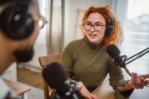 istock two radio hosts smile and enjoy while record podcast in studio 2193127650